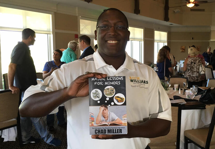 Richard Williams holding Major Lessons for Minors